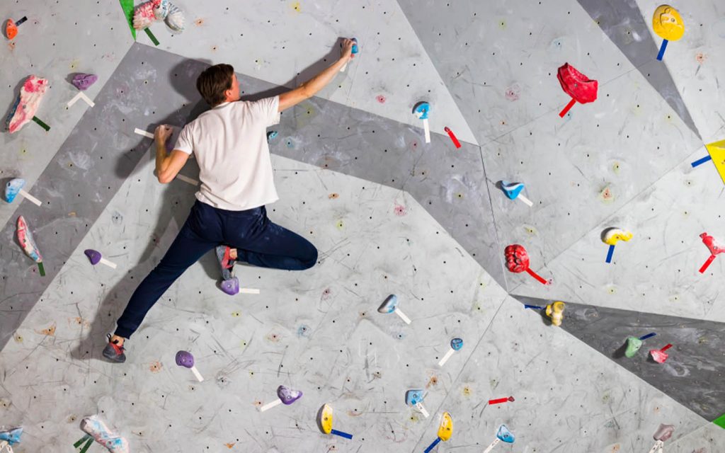 Man-climbing-wall-1024x640.jpg